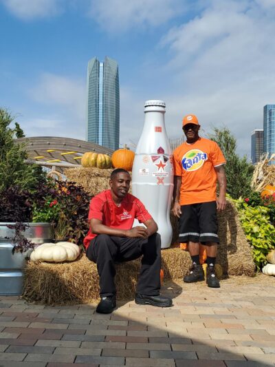 Jerome Hill & Ricky Young (left to right) from the May Avenue Warehouse in front of Oklahoma City’s tallest building, Devon Tower, on Oct. 20, 2021.