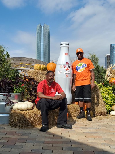 Jerome Hill & Ricky Young (left to right) from the May Avenue Warehouse in front of Oklahoma City’s tallest building, Devon Tower, on Oct. 20, 2021.