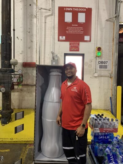 Warehouse Supervisor Richard Sampson with the Recognition Roadtrip Bottle at the Quapah facility on Oct. 25, 2021.