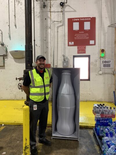 Stephen Johnson, Warehouse Manager 2, with the Recognition Roadtrip Bottle at the Quapah facility on Oct. 25, 2021.