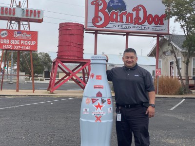 Jesse Quezada, Area Sales and Merchandising Manager, outside the legendary Barn Door Steakhouse. The Barn Door was opened 1963, and the building was originally a railway stop that dates all the way back to 1893.