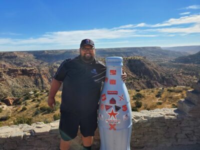 Oscar Morales, Distribution Supervisor, with the Recognition Roadtrip Bottle at Palo Duro Canyon which offers dozens of tourist activities. More than 200,000 visitors hike through 15,000 acres of Palo Duro Canyon and enjoy the campsites, ziplines, bike trails and horseback riding each year.