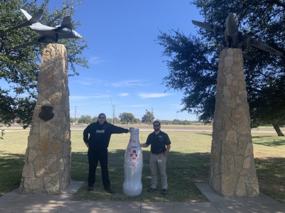 John Gardener, Warehouse Manager I, and Garret Dussia, Maintenance Manager III, at Dyess Memorial Park with the Recognition Roadtrip Bottle. CCSWB is honored to have amazing Veterans, like Dussia and Gardener, on our team!