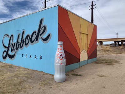 The Recognition Roadtrip Bottle in front the “Lubbock Sunrise” Mural located in downtown Lubbock on Dec. 9, 2021. Settled in 1890, Lubbock is the 11th largest city in Texas and is nicknamed “Hub City” for it being the economic, educational and health-care hub of the South Plains.