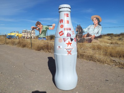 The Recognition Roadtrip Bottle posing with giant plywood artwork which pays tribute to the 1956 James Dean and Liz Taylor film, “Giant.” Located on the Ranch where the movie was filmed, the art installation completes the Western country vibe depicted in the feature film.
