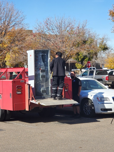 Roswell heroes load up the Recognition Roadtrip Bottle on Dec. 8, 2021 as it prepares to head back to Texas for its next stop on the Recognition Roadtrip.