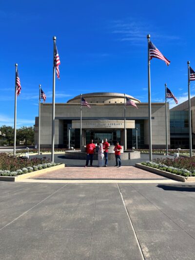 Bryan heroes with the Recognition Roadtrip Bottle at the George W. H. Bush Library. Built in 1997, the library contains more than 44 million pages of textual archives from the George W. H. Bush presidency.