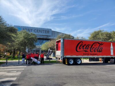 San Antonio heroes welcome the Recognition Roadtrip Bottle to San Antonio in front of the AT&T Center on Dec. 31, 2021. Opened in 2002, AT&T Center is home to the San Antonio Spurs and has a capacity of 18,500.