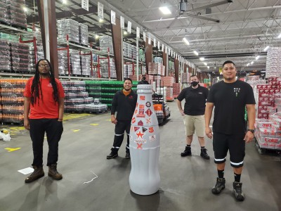Austin Texas frontline heroes welcome the Recognition Roadtrip Bottle to the Austin Distribution Center on Dec. 30, 2021.