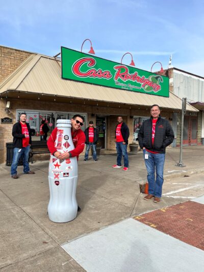 CCSWB heroes sharing a meal with the Recognition Roadtrip Bottle outside Casa Rodriguez in downtown Bryan. Built in 1978, this Mexican restaurant is famous for its “Chili con Carne.”
