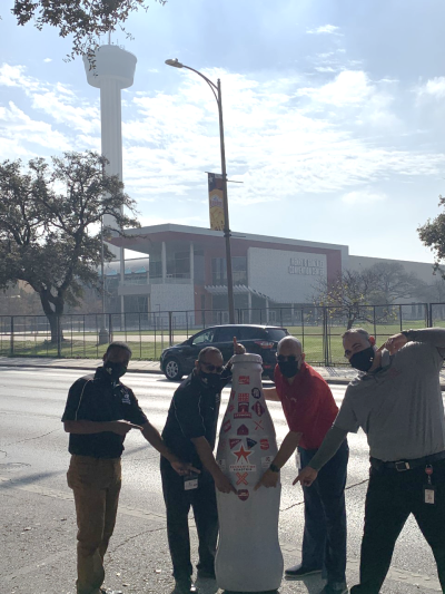 San Antonio heroes in front of the Henry B. Gonzalez Convention Center with the Recognition Roadtrip Bottle on Dec. 31, 2021. The convention center hosts over 300 events a year and its "Stars at Night" ballroom is the largest ballroom in Texas at 54,000 square feet.