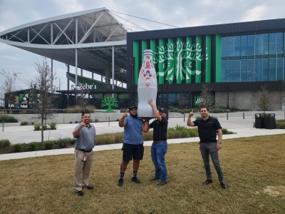 Austin heroes with the Recognition Roadtrip Bottle outside Q2 Stadium on Dec. 30, 2021. Built in 2019, Q2 Stadium is home to Austin FC and has a total capacity of 20,500 fans.