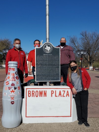 Del Rio heroes with the Recognition Roadtrip Bottle at Brown Plaza on Jan. 3, 2022. Located in downtown Del Rio, Brown plaza was dedicated on Cinco de Mayo in 1908 and continues to serve as a venue for gatherings and celebrations.