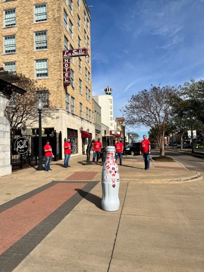Bryan heroes with the Recognition Roadtrip Bottle outside the La Salle hotel on Jan. 12, 2022. Dating back to 1866, the La Salle hotel is a current-day reminder of the early commercial development of Bryan in the late 1800s.