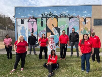 CCSWB Northpoint heroes welcome the Recognition Roadtrip bottle to Houston on January 10, 2022. The “Greetings from Houston” mural located in the Heights, designed by Houston’s renowned artist Daniel Anguilu, represents the city in the style of a 1970s postcard. It includes several icons representing Houston, from an oil derrick and rocket ship to a cattle skull and an old-school cassette tape.