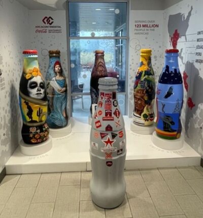 The Recognition Roadtrip Bottle ‘makes friends’ with the bottles on display at the Northpoint facility in Houston on Jan. 11, 2022. Designed by four international artists and a local Houston artist, these bottles represent different countries where Arca Continental operates!