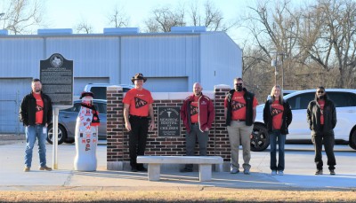 Paris heroes take the Recognition Roadtrip Bottle to the Paris CCSWB Sales Center on Feb. 15, 2022. On the Sales Center property, a State Marker commemorates the Hospital for Children and the Sanitarium of Paris McCuistion Community Hospital, which were formerly housed there. In fact, two CCSWB heroes were actually born in the hospital: Michael Flippen, Regional Sales Manager (second from the left) and Richie Huie, Northeast Director (not pictured). You could say they were born to be a part of the CCSWB team!