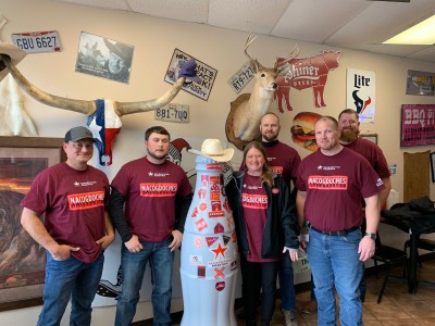 Nacogdoches heroes and the Recognition Roadtrip Bottle enjoy a well-earned meal at NacBurger in the heart of Nacogdoches on Jan. 20, 2022. We don’t normally leave our cowboy hats on at the dinner table in Texas, but we’ll make an exception for the bottle!