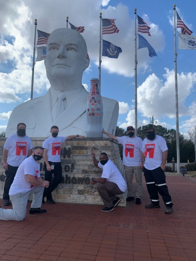 Sherman heroes take the Recognition Roadtrip Bottle on a visit to the Eisenhower Veteran’s Monument, which features a 21-foot bust of President Dwight D. Eisenhower. Designed by artist David Adickes, the monument also includes five flags representing the five branches of military service, as well as personalized engraved bricks for veterans and their years of service.
