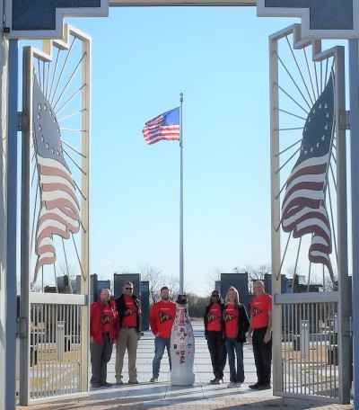 Paris heroes and the Recognition Roadtrip Bottle pay their respects at the Red River Valley Veteran’s Memorial on Feb. 15, 2022. The Memorial and its museum are built for reflection, remembrance and gratitude for the men and women who have served in the U.S. Armed Forces.