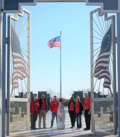 Paris heroes and the Recognition Roadtrip Bottle pay their respects at the Red River Valley Veteran’s Memorial on Feb. 15, 2022. The Memorial and its museum are built for reflection, remembrance and gratitude for the men and women who have served in the U.S. Armed Forces.