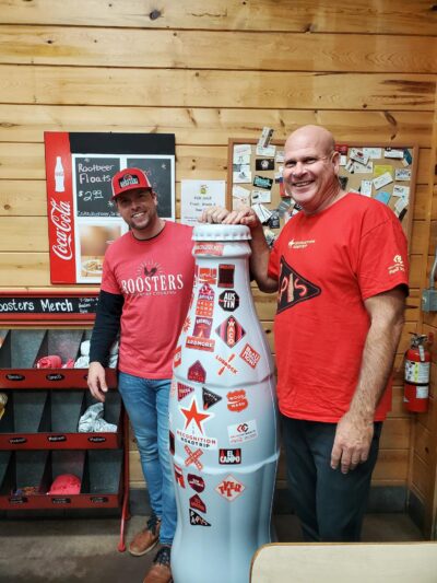 Paris heroes and the Recognition Roadtrip Bottle stop for a bite to eat at Roosters Café in neighboring town, Reno, TX. Fun fact: Roosters Café has its own family ties to CCSWB. The cafe is owned by Cayton Flippen (left), whose father, Michael Flippen (right), is the Regional Sales Manager at the CCSWB Paris Sales Center!