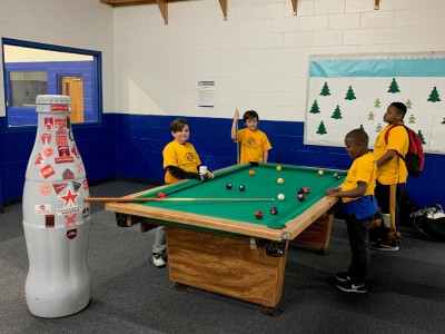 The Recognition Roadtrip Bottle “earns its stripes” during a game of pool at the Boys and Girls Club of Nacogdoches on Jan. 20, 2022.