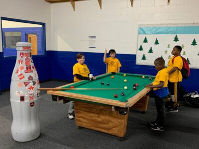The Recognition Roadtrip Bottle “earns its stripes” during a game of pool at the Boys and Girls Club of Nacogdoches on Jan. 20, 2022.