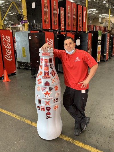 EFC hero, Anthony Ruiz, Technician, with the Recognition Roadtrip Bottle on Feb. 22, 2022.