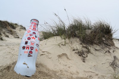 The Recognition Roadtrip Bottle catches some rays at the beach on South Padre Island on March 9, 2022. The beach is near the Laguna Madre Bay, one of six hyper-saline bays in the world with salt content higher in the bay than the rest of the ocean. This is crucial for sea life in the Gulf of Mexico – and fun for visitors, who will float better in the water!