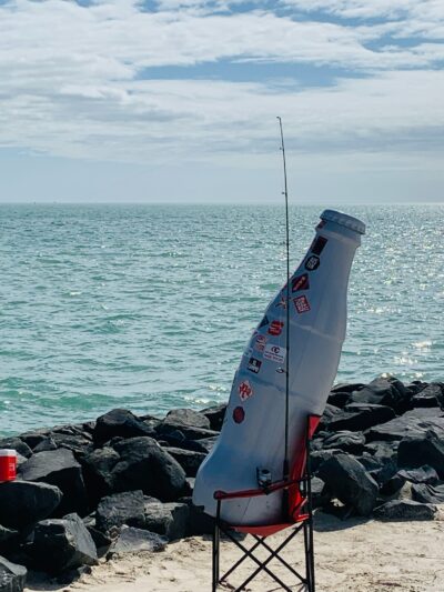 Gone fishin’! The Recognition Roadtrip Bottle takes an impromptu fishing trip at the beach on March 14, 2022.