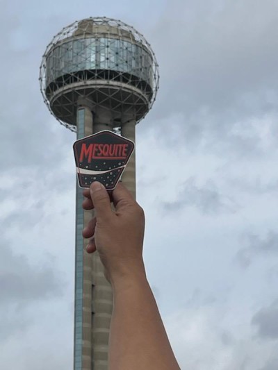 Mesquite heroes and the Recognition Roadtrip Bottle had a ball at Reunion Tower on Feb. 21, 2022! Constructed in 1978, this unique centerpiece to the Dallas skyline wasn’t originally supposed to be spherical. Originally, plans for the 561-foot tower called for a pyramid on top, or even a flat observation deck. Today, Reunion Tower is a Dallas icon, often lit up with logos for local college and professional sports teams, or supportive community messages.