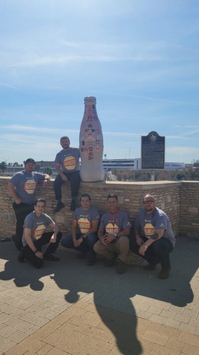 Laredo heroes take the Recognition Roadtrip Bottle to visit the Gateway to the Americas International Bridge on March 3, 2022. This Bridge, along with the World Trade Bridge, is one of four vehicular bridges that connect the United States and Mexico over the Rio Grande. Originally constructed in the 1800’s, floods have destroyed it on three occasions. Today’s bridge was constructed in 1954 and remains operational.