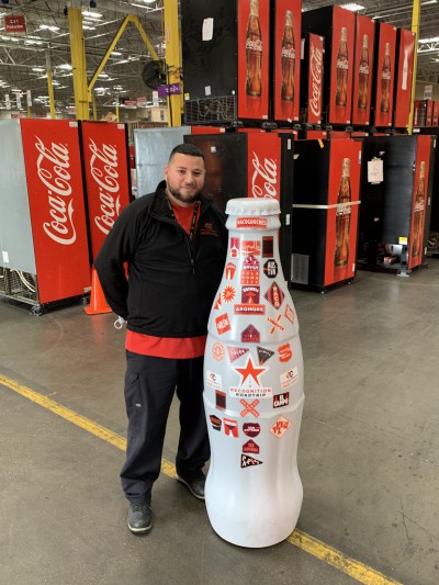 EFC hero, Jose Veiza, Technician, with the Recognition Roadtrip Bottle on Feb. 22, 2022.