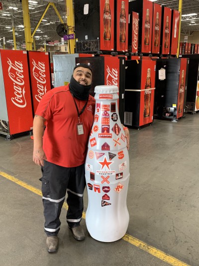 EFC hero, Kevin Escobar, Technician, with the Recognition Roadtrip Bottle on Feb. 22, 2022.