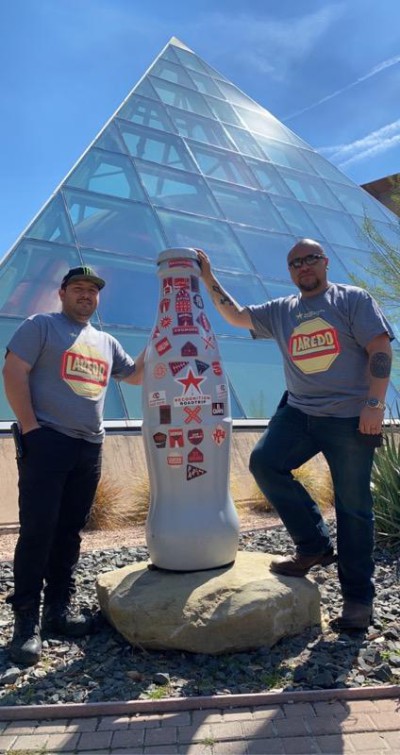 CCSWB heroes, Lead Driver Angel Perez (left) and Distribution Supervisor Joe Ramirez (right), with the Recognition Roadtrip Bottle outside the Texas A&M International University Planetarium on March 3, 2022. 