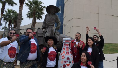 McAllen heroes saddle up with the Recognition Roadtrip Bottle by the statue of the Vaquero of Nuevo Santander outside the McAllen Performing Arts Center on March 9, 2022. The bronze statue, designed by artist Jason Scull, depicts a life-size vaquero on his horse overlooking a longhorn and her calf. It was created as a nod to the birth of the cattle industry in South Texas and Northern Mexico.