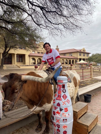 Fort Worth hero Brady Self, Distribution Manager, takes a ride with the Recognition Roadtrip Bottle and the Texas longhorn in the Stockyards on March 22, 2022.