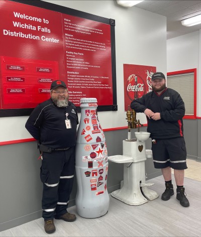 Wichita Falls heroes, Bryce Smith, Warehouse Lead, and Eddie Smith, Bulk Driver, welcome the Recognition Roadtrip Bottle to their distribution center on March 28, 2022.