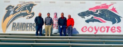 Wichita Falls heroes with the Recognition Roadtrip Bottle at Memorial Stadium on March 28, 2022. The stadium, which can seat more than 14,500 people, has served as the host to nearly a dozen bowl games, including Pioneer Bowls and the annual Oil Bowl Classic all-star game.