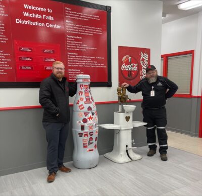 Wichita Falls heroes Patrick Harlow, Distribution Supervisor, and Eddie Smith, Bulk Driver, with the Recognition Roadtrip Bottle on March 28, 2022.
