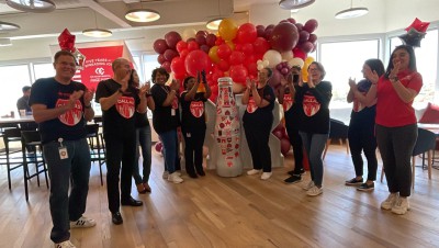 Dallas heroes with the Recognition Roadtrip Bottle at CCSWB corporate headquarters on April 1, 2022.